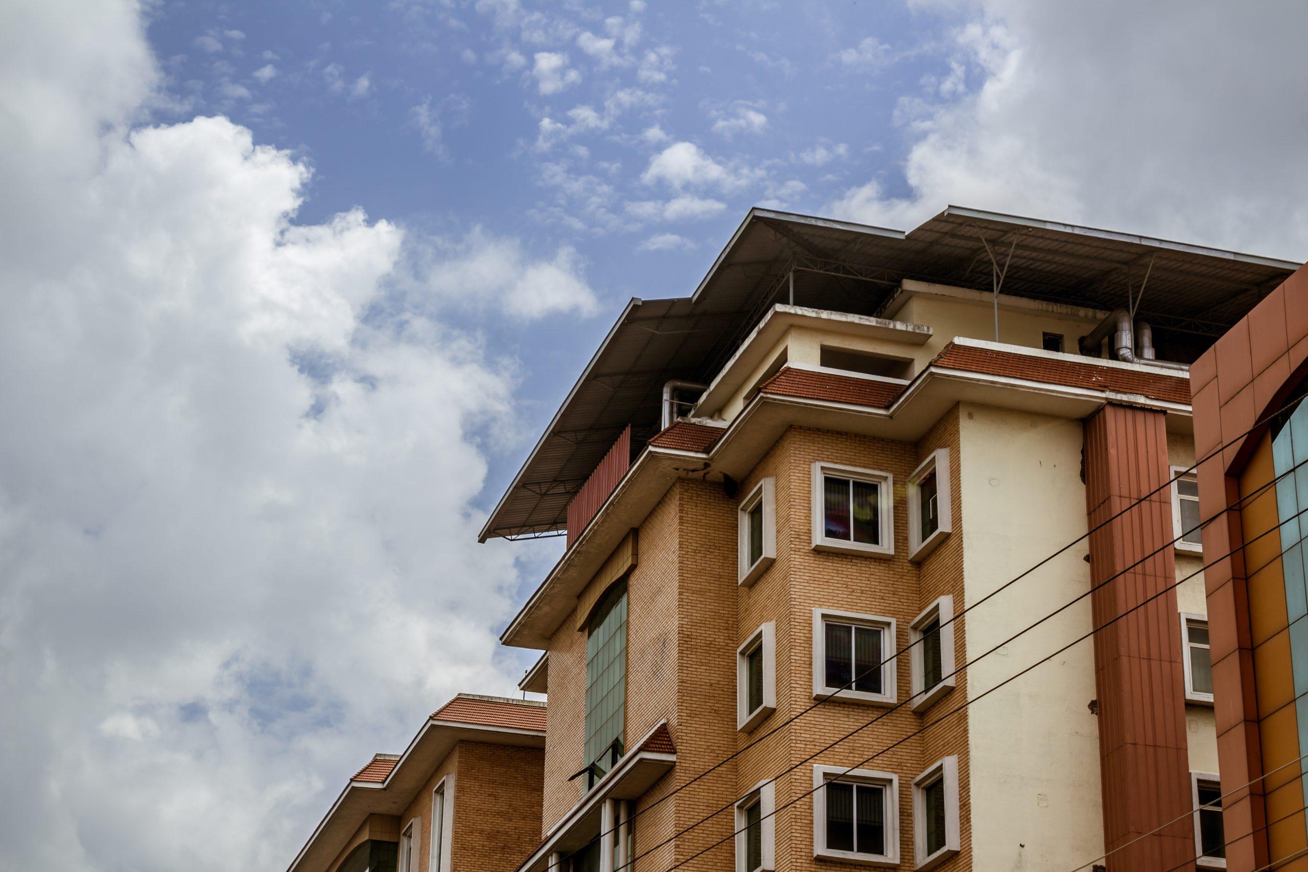 Hospital Building with clouds in the background SG-SST para copropiedades